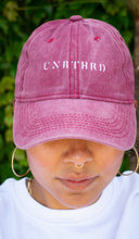 Load image into Gallery viewer, UNISEX DISTRESSED BASEBALL CAP. UNBOTHERED LOGO EMBROIDERED. RUBY RED COLOR
