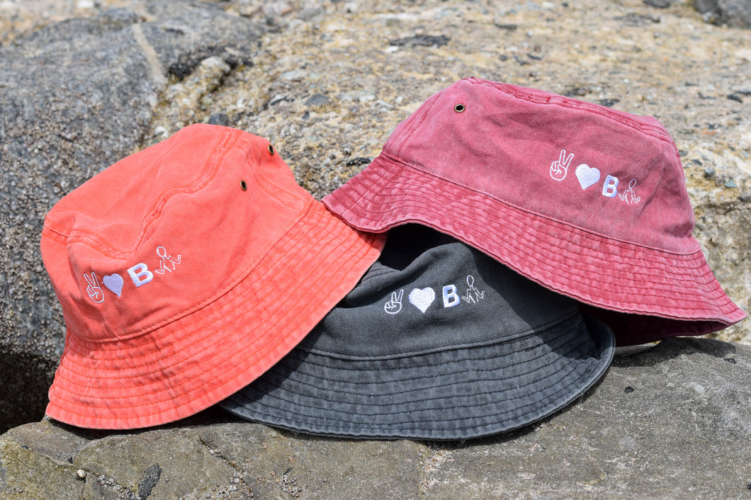 PEACE, LOVE AND BE UNBTHRD BUCKET HAT 100% COTTON UNISEX BUCKET HAT, ORANGE SODA, VINTAGE BLACK, FADED RED. 